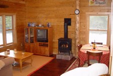 Cozy gas fireplace offers a romantic cozy atmosphere at this quiet romantic cabin.